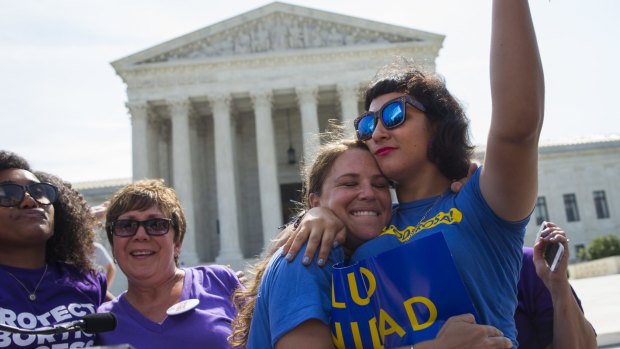 Bethany Van Kampen (left) hugs Alejandra Pablus as they celebrate during a rally at the Supreme Court in Washington  after the court struck down Texas' widely replicated regulation of abortion clinics. 