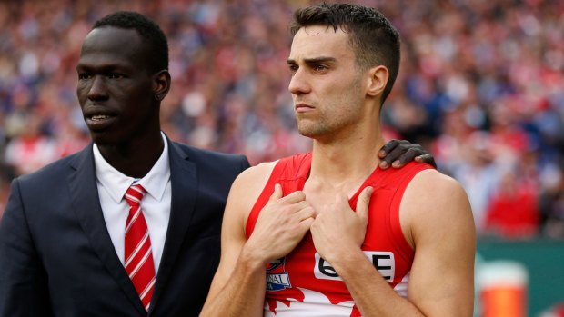 Xavier Richards and Aliir Aliir commiserate after this year's grand final.