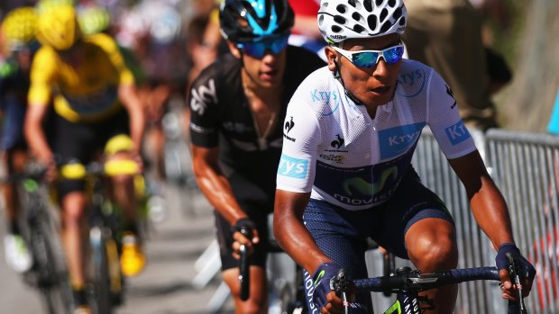 Richie Porte (C) shadows Nairo Quintana (R) as he attacks race leader Chris Froome (L) on the Alpe d'Huez.