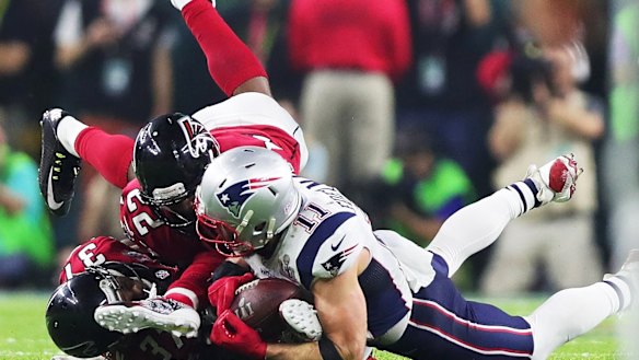 In hand: Edelman completes the play.