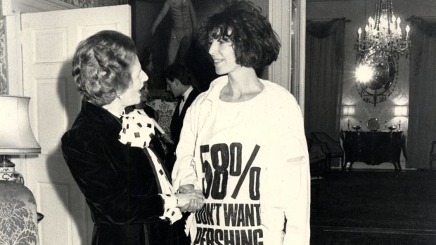 Katharine Hamnett made history in 1985 when she collected her British Designer of the Year award and greeted Prime MInister Margaret Thatcher dressed in a "58% Don't Want Pershing' T-shirt" referring to the opposition to US Pershing missiles in Britain.