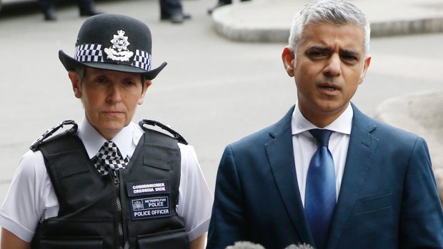 Mayor of London Sadiq Khan (right) talks to reporters alongside London Police Commissioner Cressida Dick (left). 
