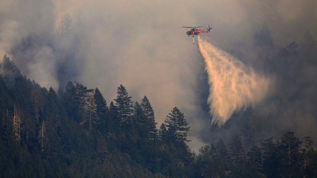 Helitanker 743 drops water on a wildfire on Mt. St. Helena, north of Calistoga, California.
