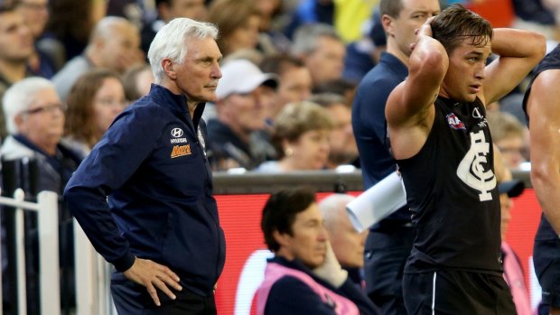 Carlton coach Mick Malthouse watches his players surrender on Friday night.