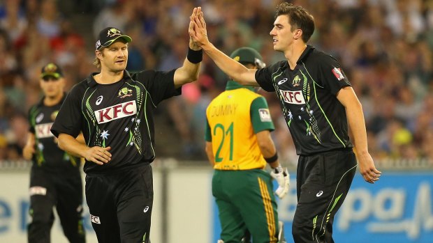 Patrick Cummins (right) in a rare moment of celebration on the field, alongside Shane Watson playing against South Africa in a Twenty20 clash at the MCG in 2014.