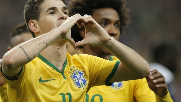 Oscar, left, celebrates with his Brazilian teammate Willian after scoring his side's first goal.