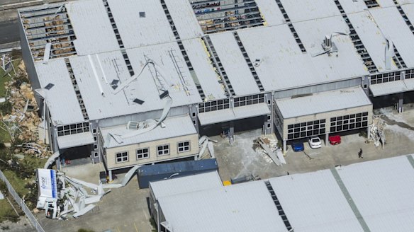 A truck lies on its side next to damaged buildings at the Kurnell plant.