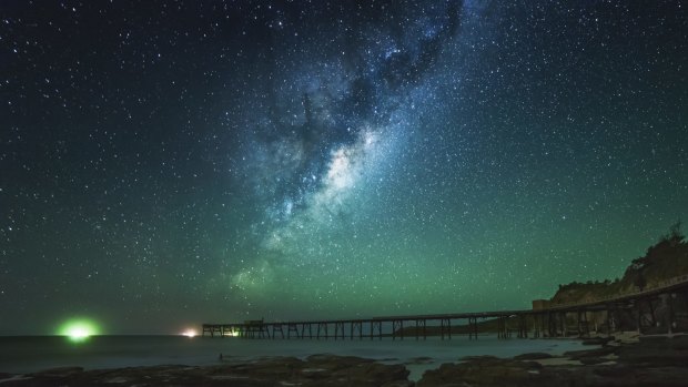 Hundreds of galaxies have been discovered hiding behind the glowing disk of the Milky Way. This photo was taken at Catherine Hill Bay.
