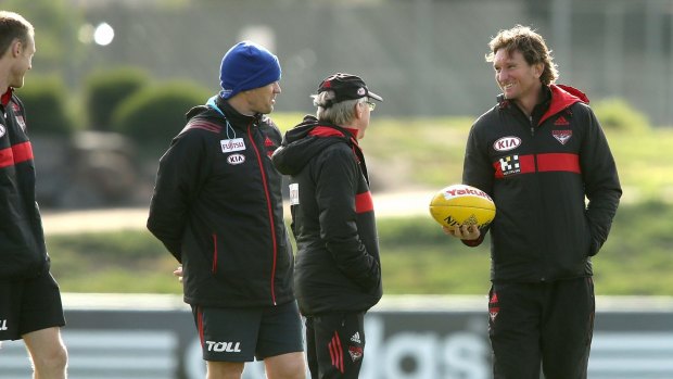 Essendon players at a training session with James Hird on Friday.