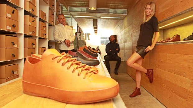 Feit founders Josh and Tull Price with model Amanda Griffith at their Darlinghurst store.