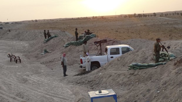 Determined resistance: Tribal fighters dig in against Islamic State militants in the town of Amriyat al-Falluja in Anbar province.