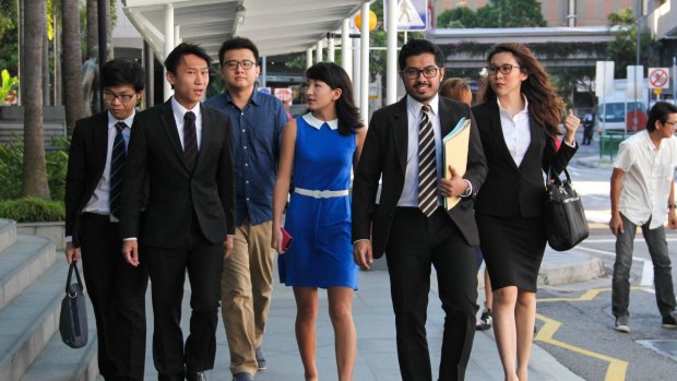University of Queensland student Ai Takagi and former student Yang Kaiheng with their legal team earlier in the case.