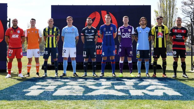 Two to be added: Players from the existing 10 teams line up for this season's launch.