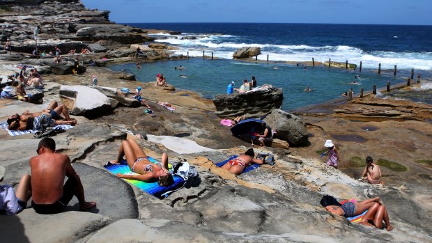 Swimmers and sunbathers alike enjoy another hot day in Sydney at Mahon Pool in Sydney's eastern suburbs.