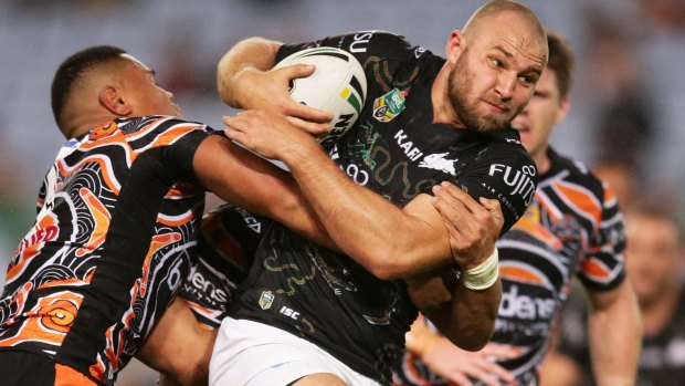 Go-forward: Robbie Rochow is tackled at ANZ Stadium.