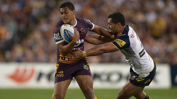 Anthony Milford of the Broncos is tackled during the 2015 NRL Grand Final.