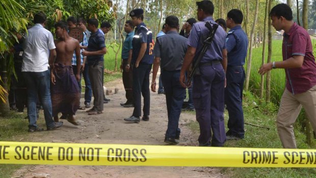 Security officers at the Rangpur site where a Japanese man, Kunio Hoshi, was shot dead on Saturday.