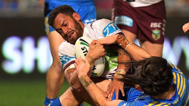 New lease of life: Apisai Koroisau drives over the line to score for Manly.