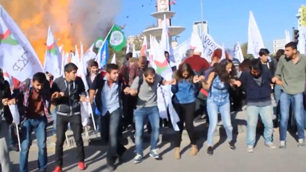 Participants in the October 10 peace rally in Ankara react at the moment of the first explosion. Islamic State has been blamed for the attack on the rally, made up largely of leftists and HDP activists.