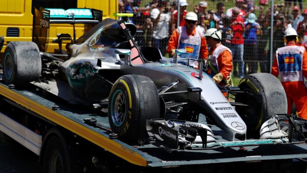 The car of Nico Rosberg of Germany and Mercedes is removed from the Spanish circuit.