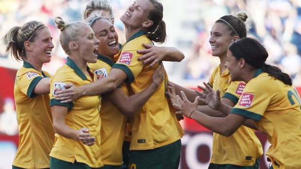 Australia celebrate a goal in their World Cup clash against Nigeria.