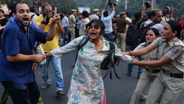 Smooch-free zone: Indian police in Delhi attempt to stop "Kiss of Love" protesters from marching on the headquarters of the RSS, a Hindu nationalist organisation linked to India's ruling Bharatiya Janata Party.