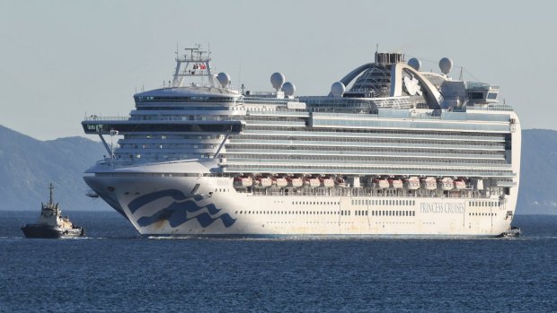 The Ruby Princess, carrying hundreds of sick crew, enters Port Kembla.