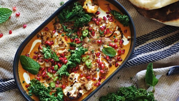 Cauliflower steaks swimming in coconut saffron curry.