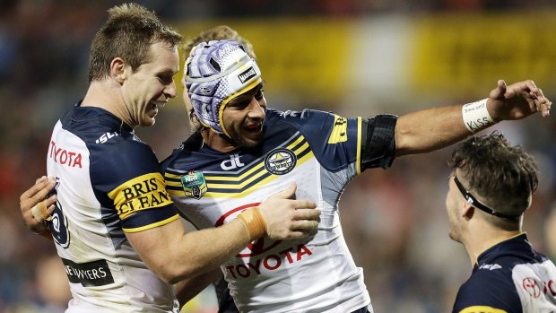 Show time: Johnathan Thurston and Michael Morgan congratulate Ethan Lowe after his try against the Panthers.