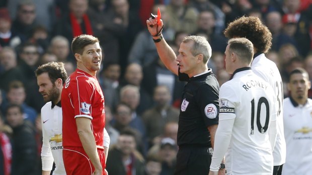 Liverpool's Steven Gerrard is shown a red card by referee Martin Atkinson 43 seconds after coming on at halftime.