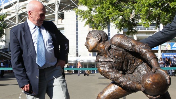 Solid status: Ken Catchpole stands with a bronze statue of his likeness outside the SFS in honor as one of the greatest Wallaby Test players ever.