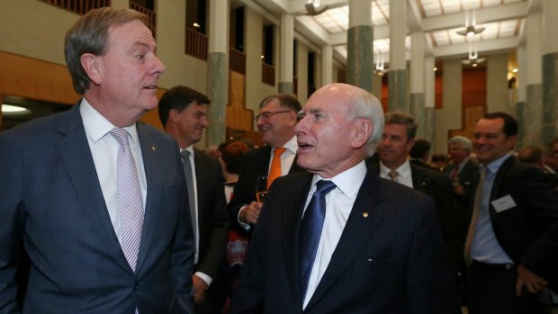 Former treasurer Peter Costello and former prime minister John Howard celebrate the 20th anniversary of Howard's 1996 election victory.