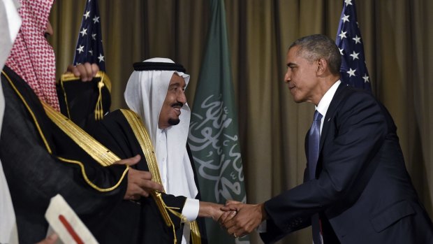 Mr Obama shakes hands with King Salman of Saudi Arabia before the two sat down for talks during the summit.