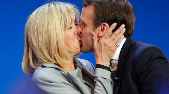 French centrist presidential candidate Emmanuel Macron kisses his wife Brigitte before addressing his supporters at his election day headquarters in Paris on Sunday.