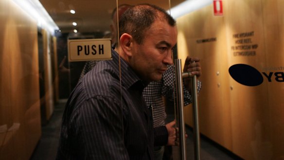 Long walk: Eddie Jones arrives at the press conference to announce his sacking from the Wallabies top job in December 2005.