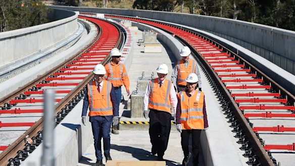Premier Gladys Berejiklian, right, and Transport Minister Andrew Constance tour the Skytrain viaduct at Rouse Hill.