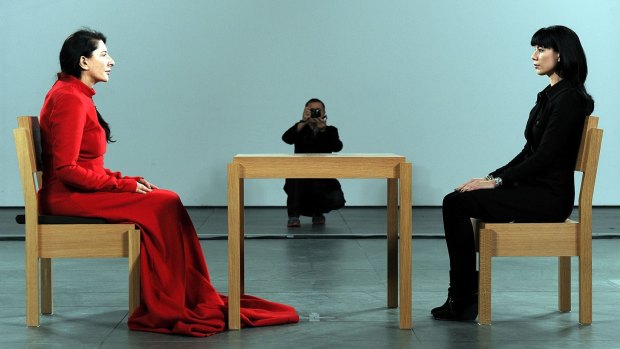 Marina Abramovic, present with a visitor.