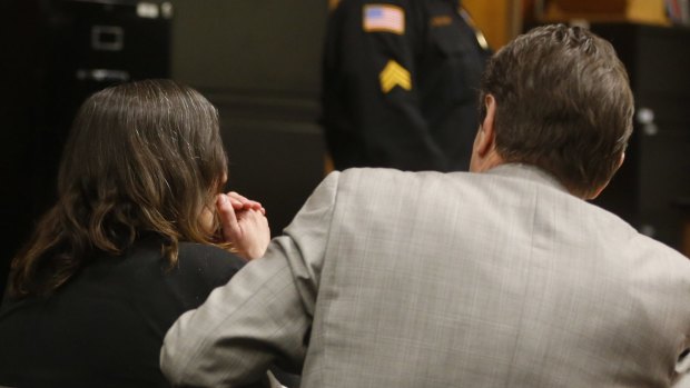 Michelle Lodzinski lsits in the Middlesex County courthouse with her lawyer Gerald Krovatin waiting to hear the verdict in her murder trial on Wednesday.