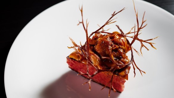Wagyu rib cap topped with mushrooms and branches made from dehydrated mushroom.