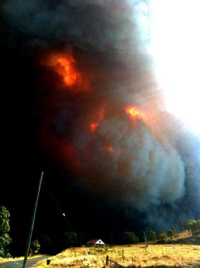 Out of control: The fire on the road between Coonabarabran and the Warrambungles on Sunday, January 13, 2013.