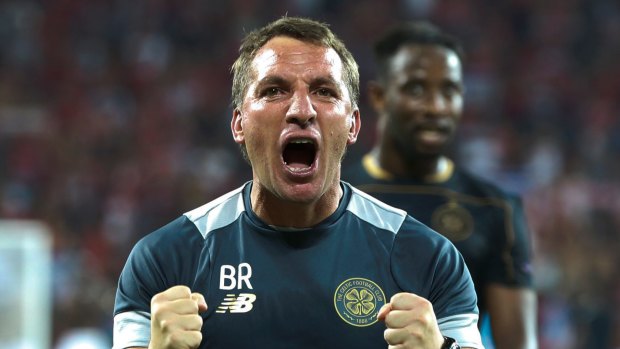 Celtic manager Brendan Rodgers celebrates after his side qualify for the Champions League group stage.