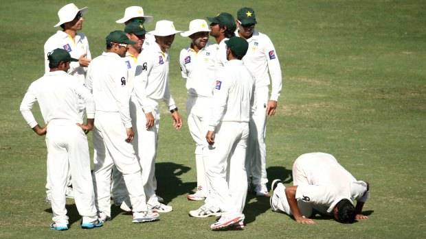 Yasir Shah drops to th floor after dismissing Australian youngster Steve Smith, one of his three wickets for the innings.