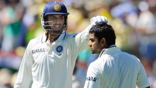 Ishant Sharma congratulates Virat Kohli on his 100 runs against Australia in the Adelaide Test on January 26, 2012. 