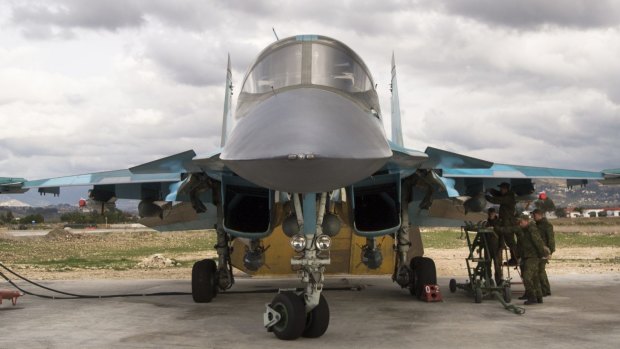 A Russian air force crew prepare a bomber for a combat mission at Hemeimeem air base in Syria in January. 