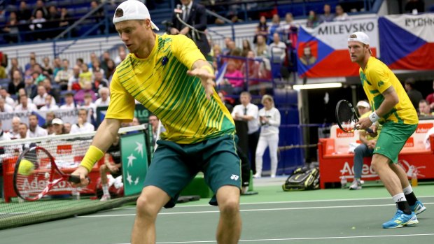 Beaten: Lleyton Hewitt, left,  and Sam Groth lose an error-riddled doubles rubber.
