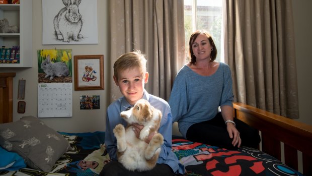 Katrina Baulch with her son Jack and Jack's rabbit Gushi.