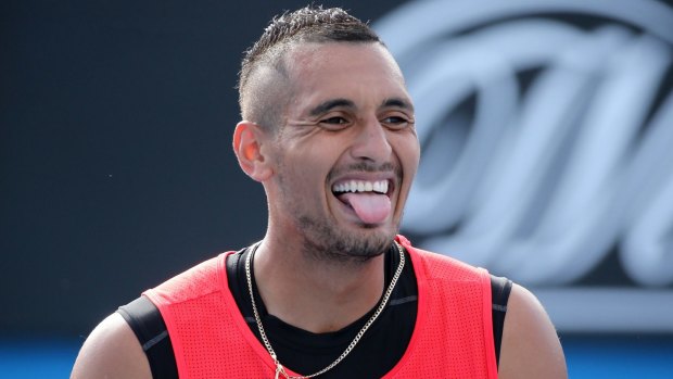 Grin and bear it:  Nick Kyrgios during a first round mixed doubles match.