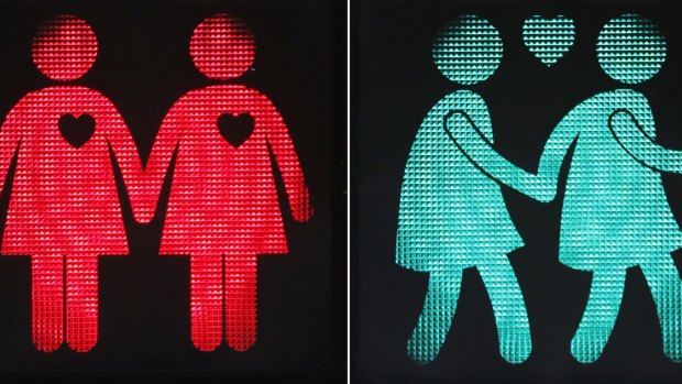 A combination of pictures shows new traffic lights showing female same-sex couples in Vienna.