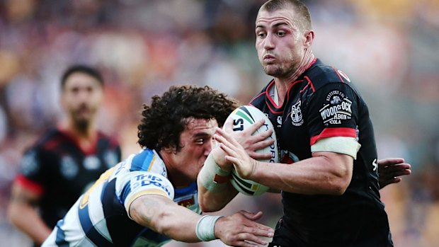 Back in action: Kieran Foran slips past Kevin Proctor.