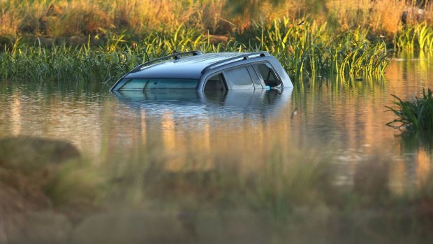 Akon Guode's car in the lake where three of her children died in April 2015.